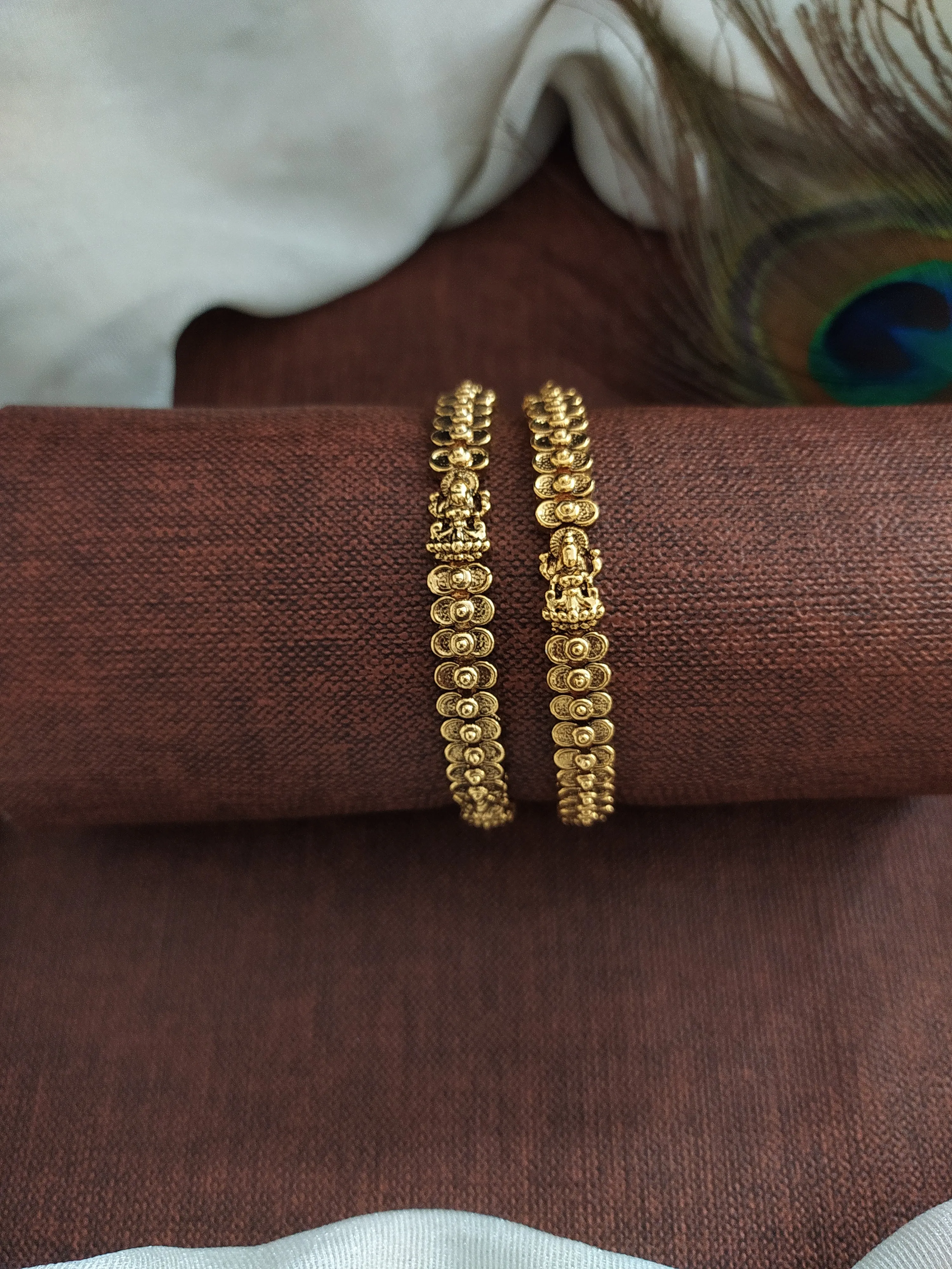 "Antique Plain Gold Lakshmi Bangles with Floral Design"